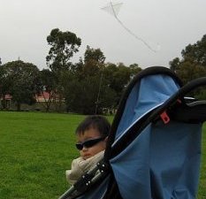 Child Flying Kite - Aren flying the 1-Skewer Diamond from his pram.