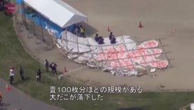 The huge kite hit nose first and then toppled onto a crowd of spectators watching the festival on a windy day in Higashiomi.
