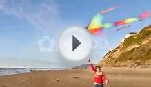 Girl Flying Kite At Beach